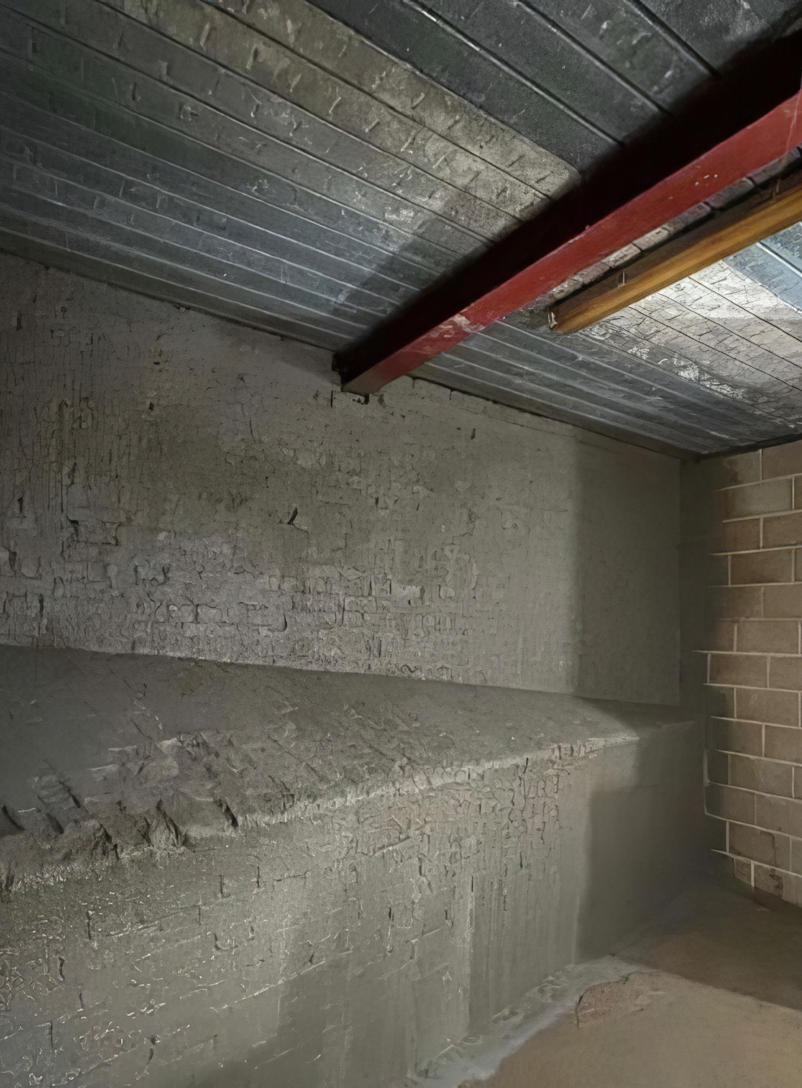 Damp affected basement wall after remedial waterproofing